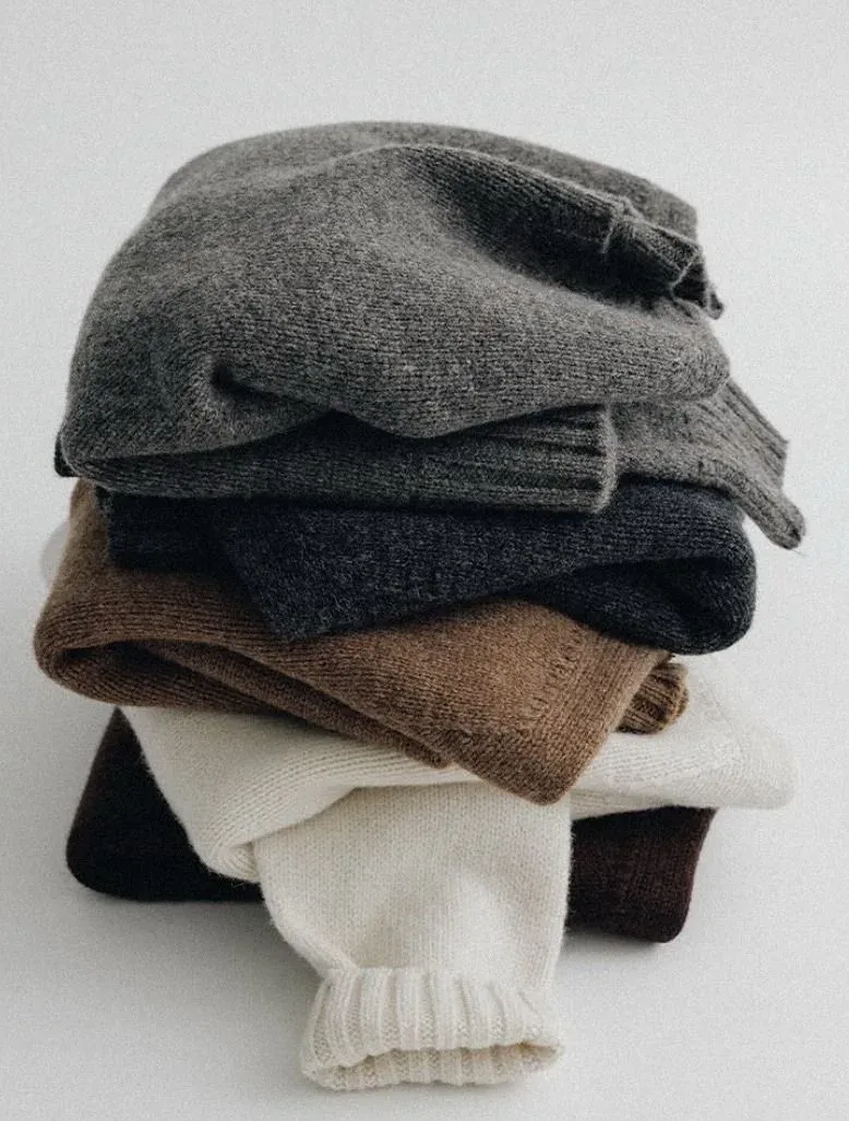 Customer close-up of a pile of folded knits