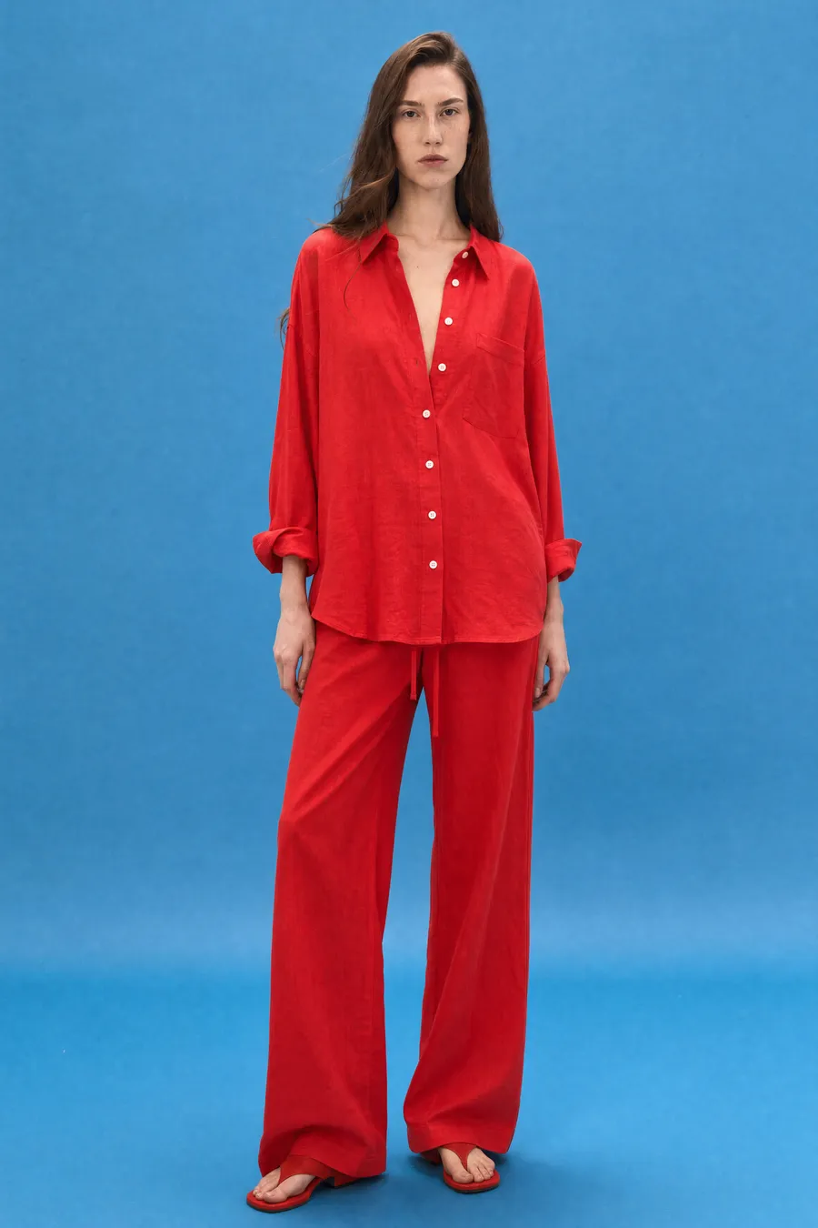 Delucca Spring Collection: on-model look 3 on a blue studio backdrop