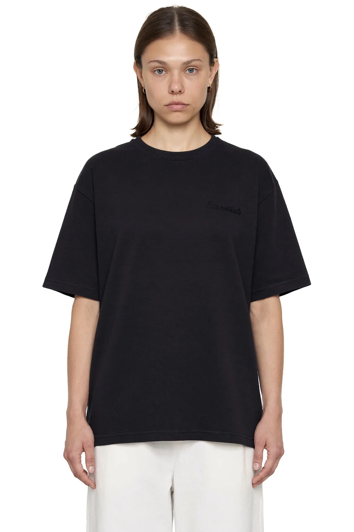 Closer front view of the black oversized tee, cropped at the hips